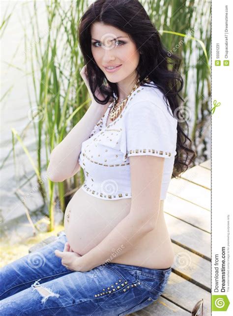 Pregnant Brunette Girl Sitting On Bridge Near Stock Image Image Of