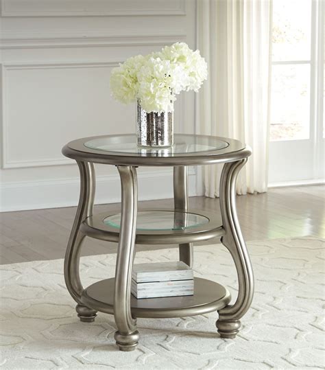 Coralayne Silver Round End Table From Ashley T820 6 Coleman Furniture