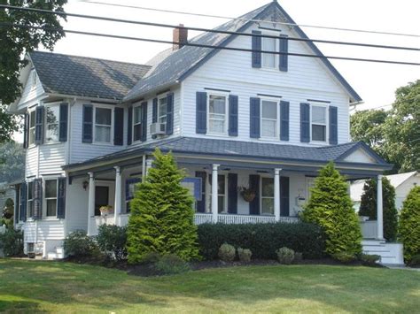 Wraparound porches have curb appeal covered. c. 1920 Victorian in Jamesburg, New Jersey - OldHouses.com