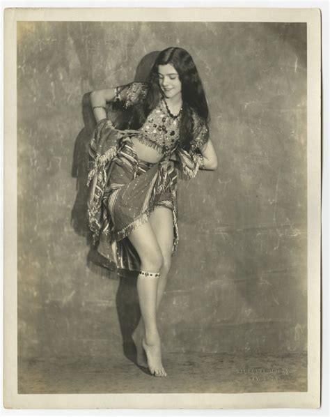 An Old Fashion Photo Of A Woman In A Belly Dance Pose With Her Hair