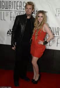 Avril Lavigne Is A Lady In Red As She Ditches Her Skater Style For