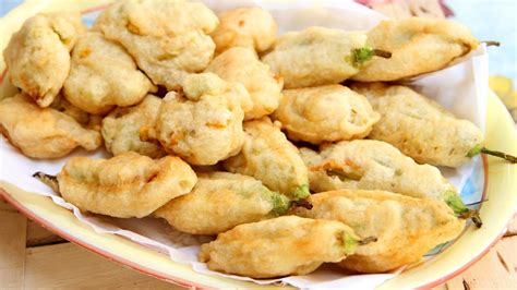 How to make zucchini flower fritters. Nonna's Zucchini Flower Fritters Recipe - Laura Vitale ...