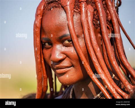 Portrait Of A Young Woman Of The Himba Tribe With A Traditional