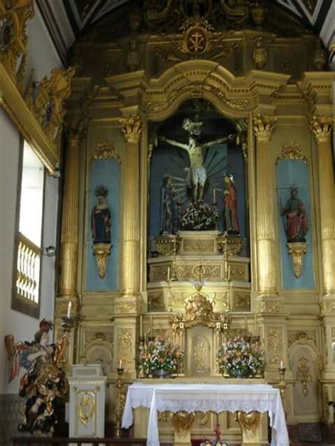 The Alter Of An Old Church With Gold And White Decor