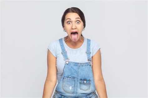 Disobedient Woman Sticking Out Tongue And Grimacing Aping Showing Derisive Naughty Expression