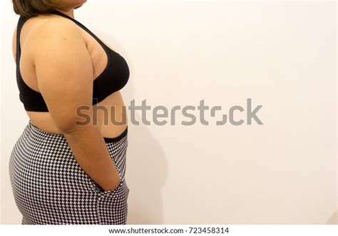 Overweight Woman Trying Fasten Her Skirt Stock Photo