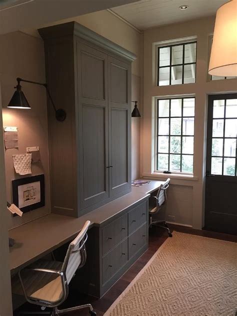 Home Office For Two Features Gray Cabinets Adorned With