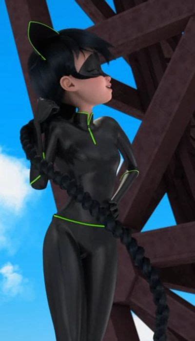 A Woman In Black Catsuit Standing On Top Of A Wooden Structure With Her