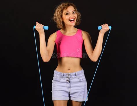 fitness woman with jumping rope smiling sportive girl with skipping rope stock image image