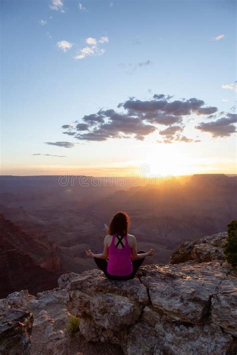 Adventurous Traveler Woman Doing Meditation On Desert Rocky Mountain