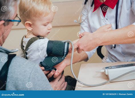 Doctor Measuring Blood Pressure Of A Child Stock Image Image Of