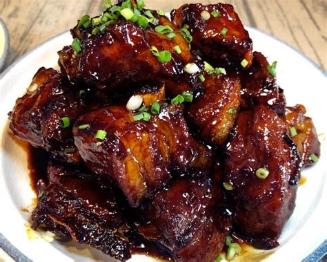 Authentic and homemade chinese bbq pork marinated with sticky char siu sauce and roasted in oven. Home cooking braised pork - Authentic Chinese Food Recipes
