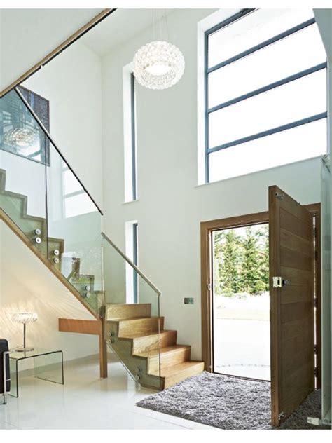 You can also plan for a stone with carved farm name and details besides your entrance gate. Double height, light entrance | Stairs design, House entrance, Modern entrance