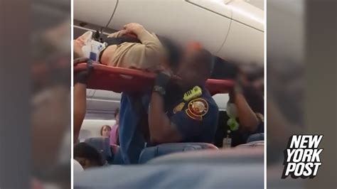 Passengers Seen Being Taken Off Delta Flight On Stretchers After