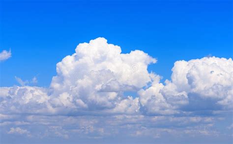 White Fluffy Clouds Against The Blue Sky Stock Photo Image Of