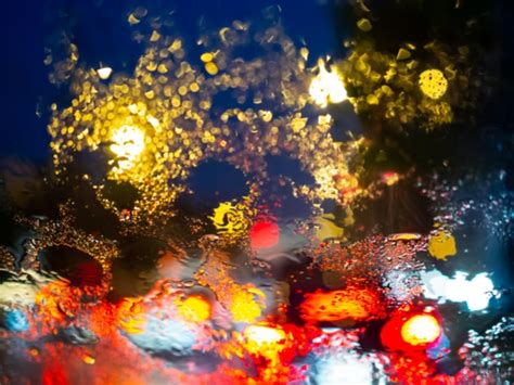 Premium Photo Blurred Rain Drops On Car Window With Road Light Bokeh