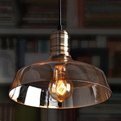 A fine steel base gives the baskin cone pendant a modernized feel, which works in direct contrast to the vintage filament bulb at its center. Industrial Vintage Hanging Pendant Light Barn Style with Amber Glass Shade - Beautifulhalo.com