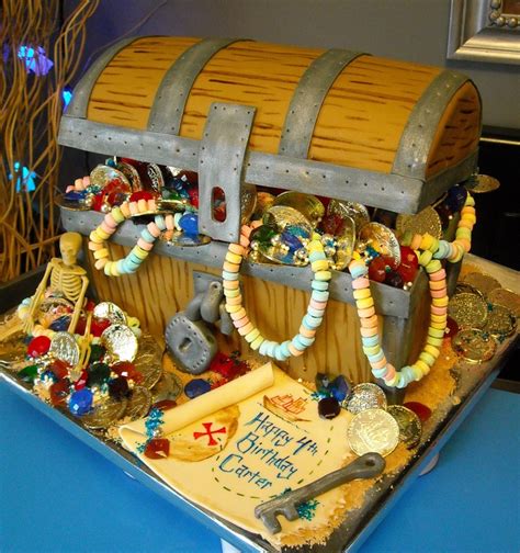A Birthday Cake Made To Look Like A Pirate S Chest With Beads And Decorations