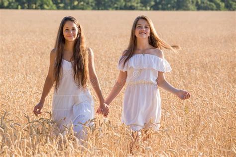 Two Girls Walking Together On Wheat Field Stock Image Image Of Love