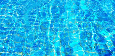 Wave Or Ripple Water In Swimming Pool With Sunlight Reflection For Background Stock Image