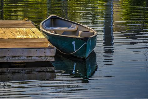 Docked Rowboat On Lake Download For Your Personal Or Commercial Project Row Boat Lake Boat