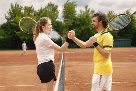 Two Tennis Players Shaking Hands At Tennis Court Before The Match Stock Photo Image Of Female