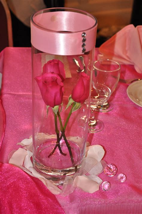 Quinceanera diy centerpiece, easy to make and affordable. Quinceanera Centerpiece | Clear vase wrapped with a pink sat… | Flickr