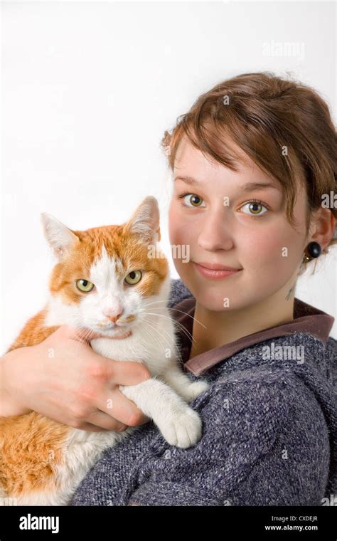 A Young Girl Holding A Cat Stock Photo Alamy