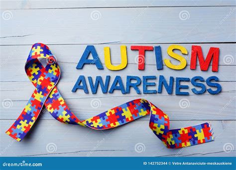 World Autism Awareness And Pride Day Or Month With Puzzle Pattern