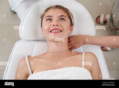 Closeup Of Relaxed Young Woman Laying On Table In Spa Center Relaxing