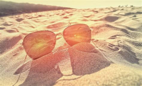 Sunglasses On The Sand At Sunset Hd Wallpaper