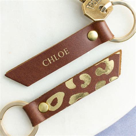 Whether you're looking for a unique leather gift for him or for her, the right gift is just waiting to be monogrammed. personalised gold leopard print leather keyring by create ...