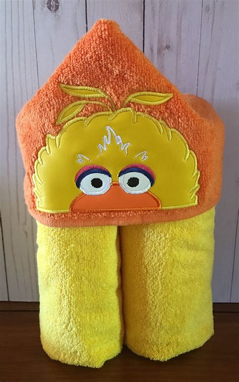 You can also buy hooded bath towels with fun animal ears and colors, and some for babies too. Hooded bath towel with an embroidered character on it by ...