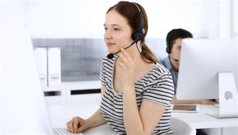 Group Of Operators At Work Call Center Focus On Beautiful Woman Receptionist In Headset At