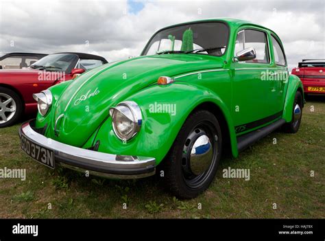 Three Quarter Front View Of A Green 1974 Volkswagen Beetle On Display