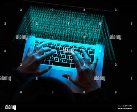 Cyber Crime A Hacker Using A Virus To Attack Software Stock Photo Alamy
