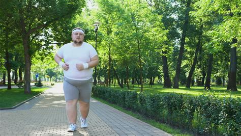 This past weekend we went for a long run in some pretty strong winds and it seemed like the wind was in our face both ways. Purposeful Fat Man Running in Stock Footage Video (100% ...