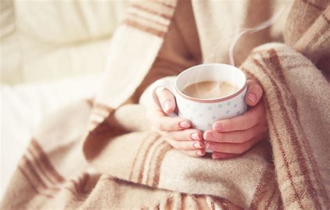 35293315 Warm Cup Of Hot Coffee Warming In The Hands Of A Girl All