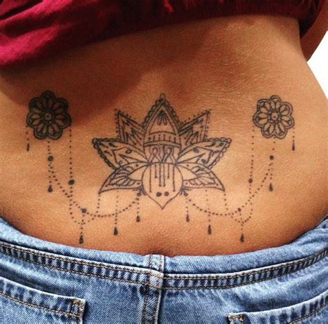 Lotus Flower Lower Back Tattoo Dont Like The Small Ones On Side But Love The Placement