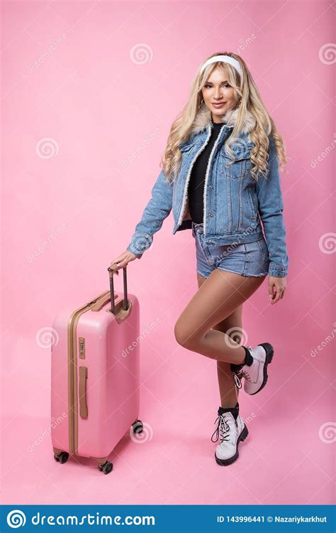 Cute Girl Blonde With Pink Suitcase Standing On Pink Background Stock