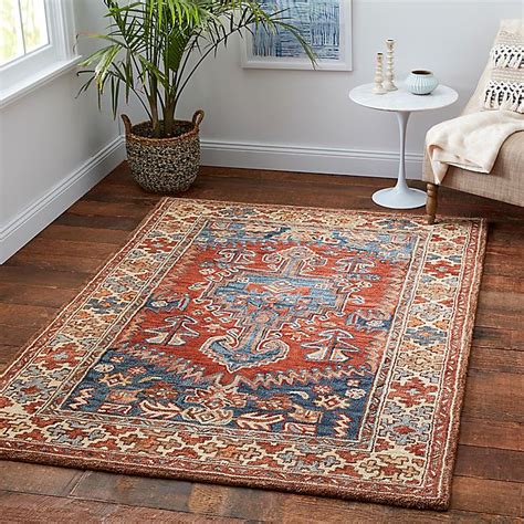 We travel the globe to bring you rugs that celebrate artistry, craftsmanship and style. Sienna Wool Area Rug in Rust/Blue | Bed Bath & Beyond
