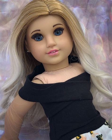 this is a custom american girl doll she was made with a girl of the year mckenna she got a bea