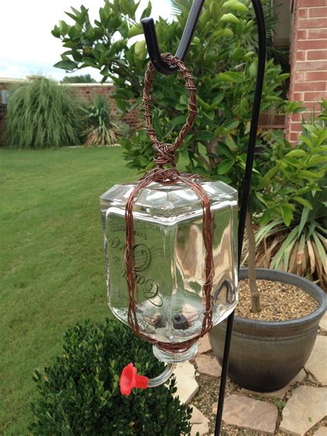 Mix 1 part sugar with 4 parts water (for example, 1 cup of sugar with 4 cups of water) until the sugar is dissolved do not add red dye fill your hummingbird feeders with the sugar water and place outside Homemade hummingbird feeder made from tequila bottle ...