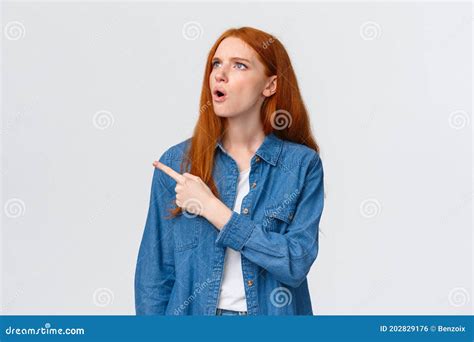 Perplexed And Indecisive Redhead Cute Girl Cant Understand Wtf Is That Pointing Looking Upper