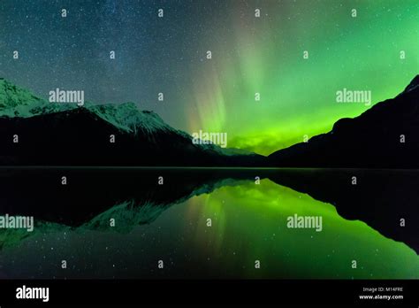 The Aurora Borealis Is Reflected In Chilkoot Lake Near Haines In