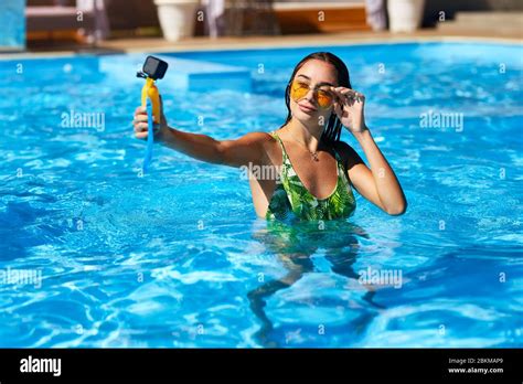 Travel Blogger Woman Taking Selfie Photo With Action Camera In A