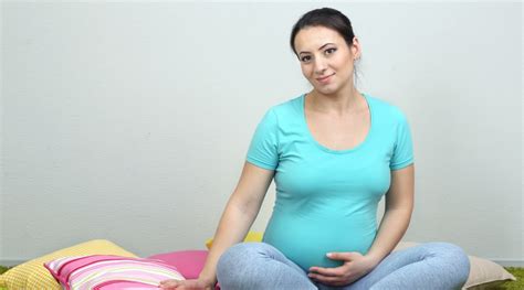 Young Pregnant Woman Sitting The Pulse