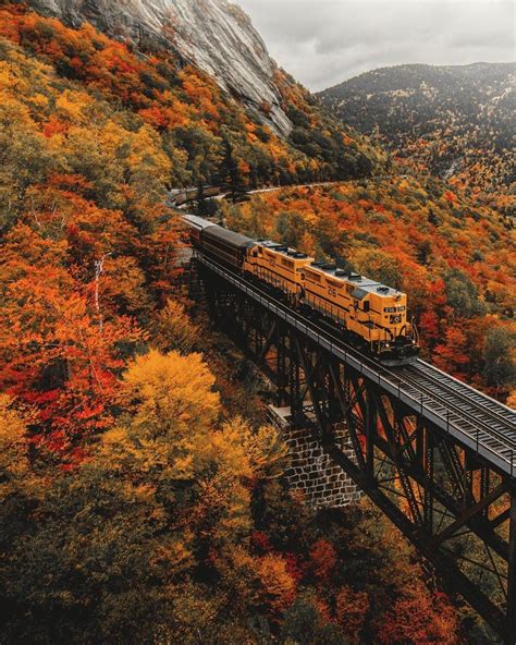 A Southbound Conway Scenic Railroad Train Surrounded By Fall Colors As