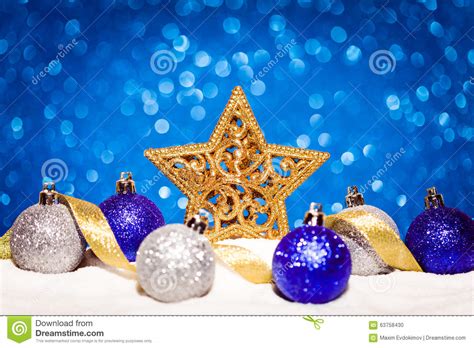 Christmas Star In Snow On Glitter Blue Background Stock Photo Image