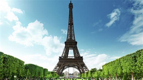 Paris Eiffel Tower And Trees On Side With Blue Sky Background During